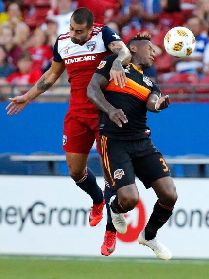 FC Dallas defender Marquinhos Pedroso (6) attempts a header over Houston Dynamo defender...