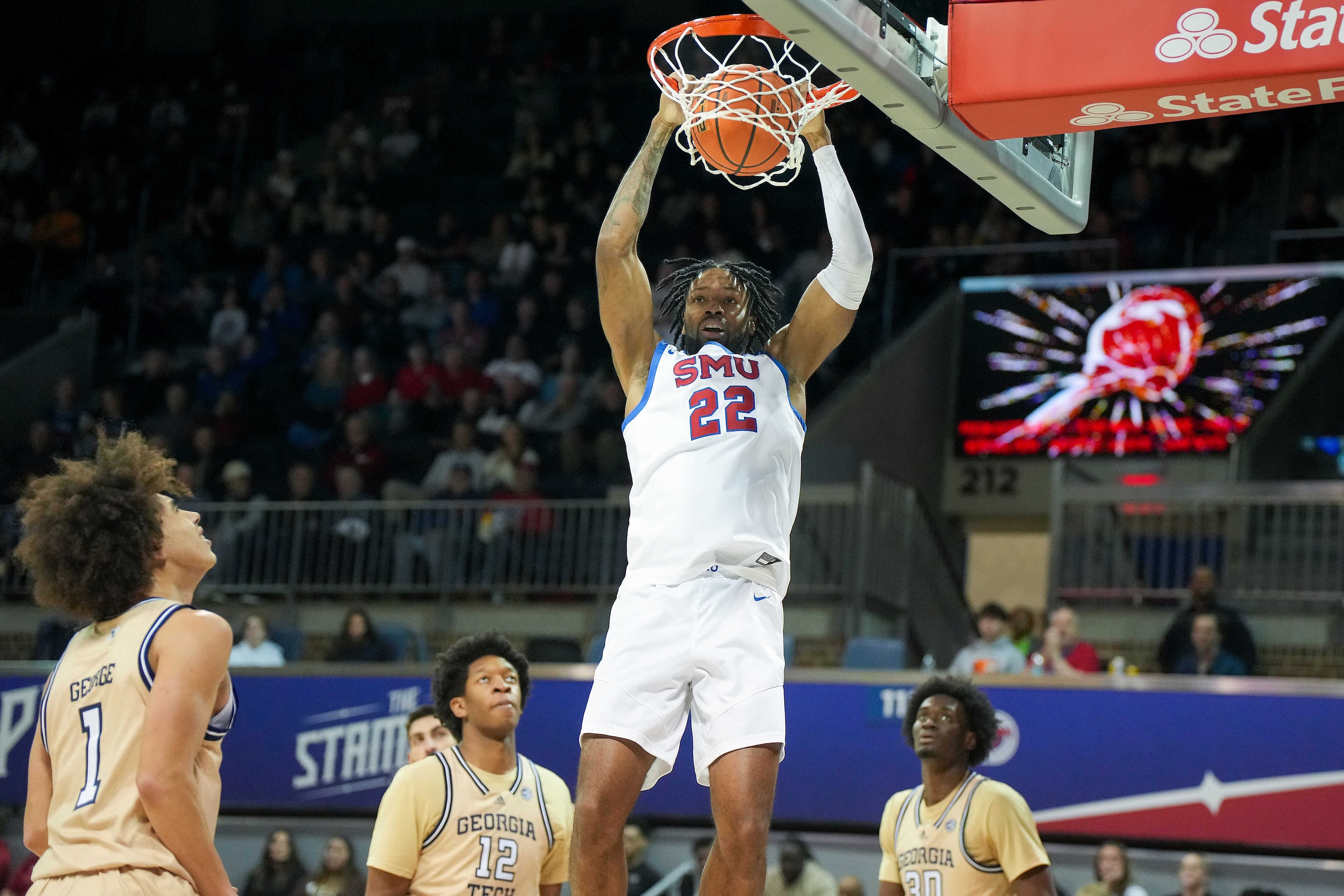 SMU forward Keon Ambrose-Hylton (22) dunks the ball as Georgia Tech guard Naithan George...