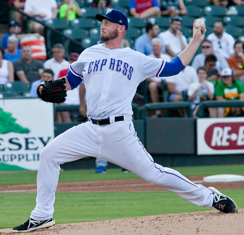 Pitcher Matt Harrison (54) pitches as he continues his comeback from lower lumbar spinal...