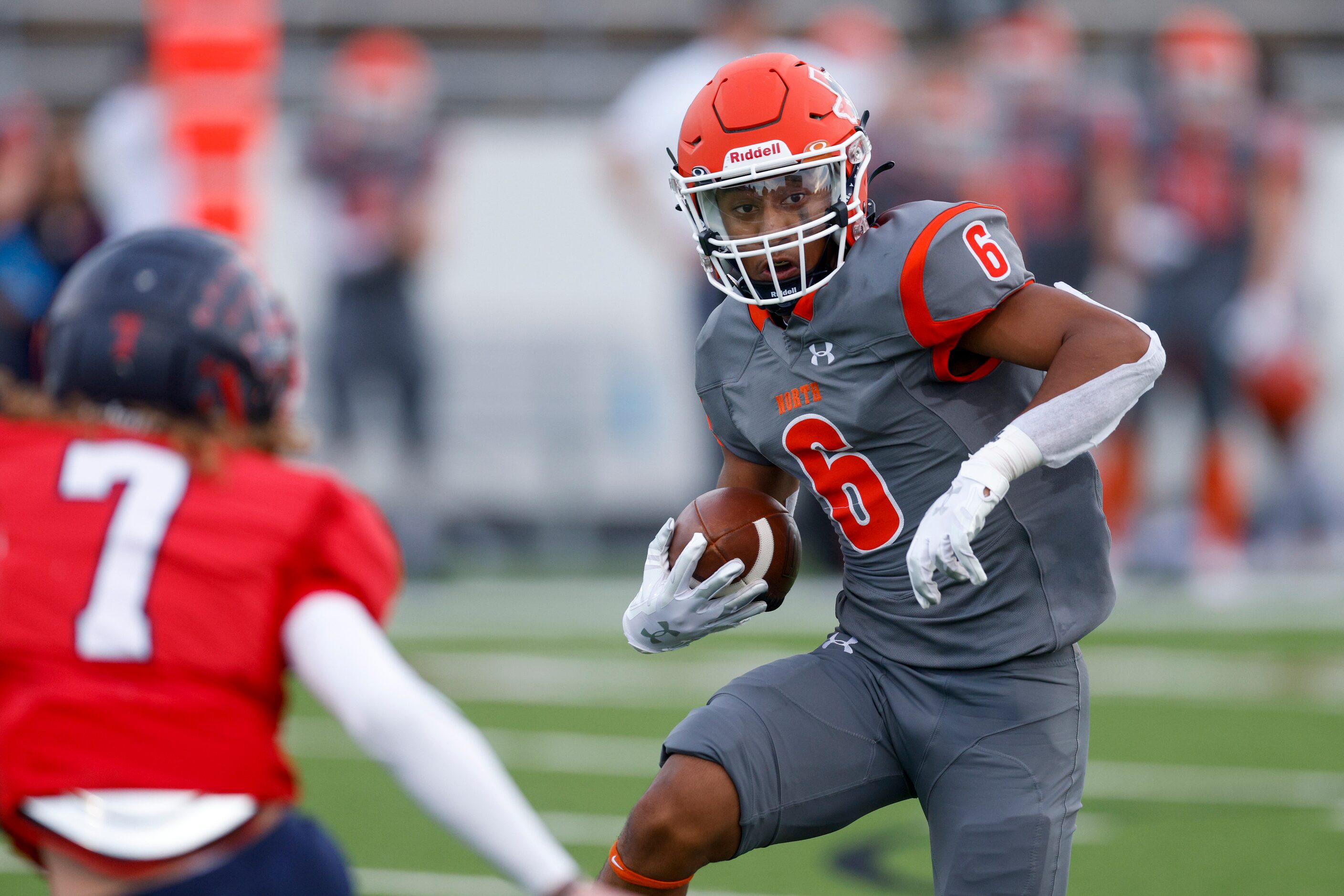 McKinney North wide receiver Gavin Constantine (6) evades Justin Northwest defensive back...