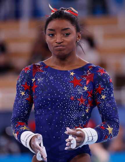 USA’s Simone Biles before competing on the uneven bars in a women’s gymnastics event during...