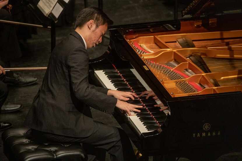 Pianist Hsin-Hao Yang performs with artistic director Richard McKay and the Dallas Chamber...