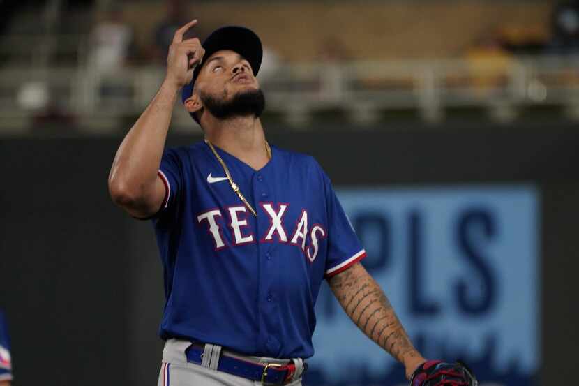 Texas Rangers relief pitcher Jonathan Hernandez celebrates the final out against the...