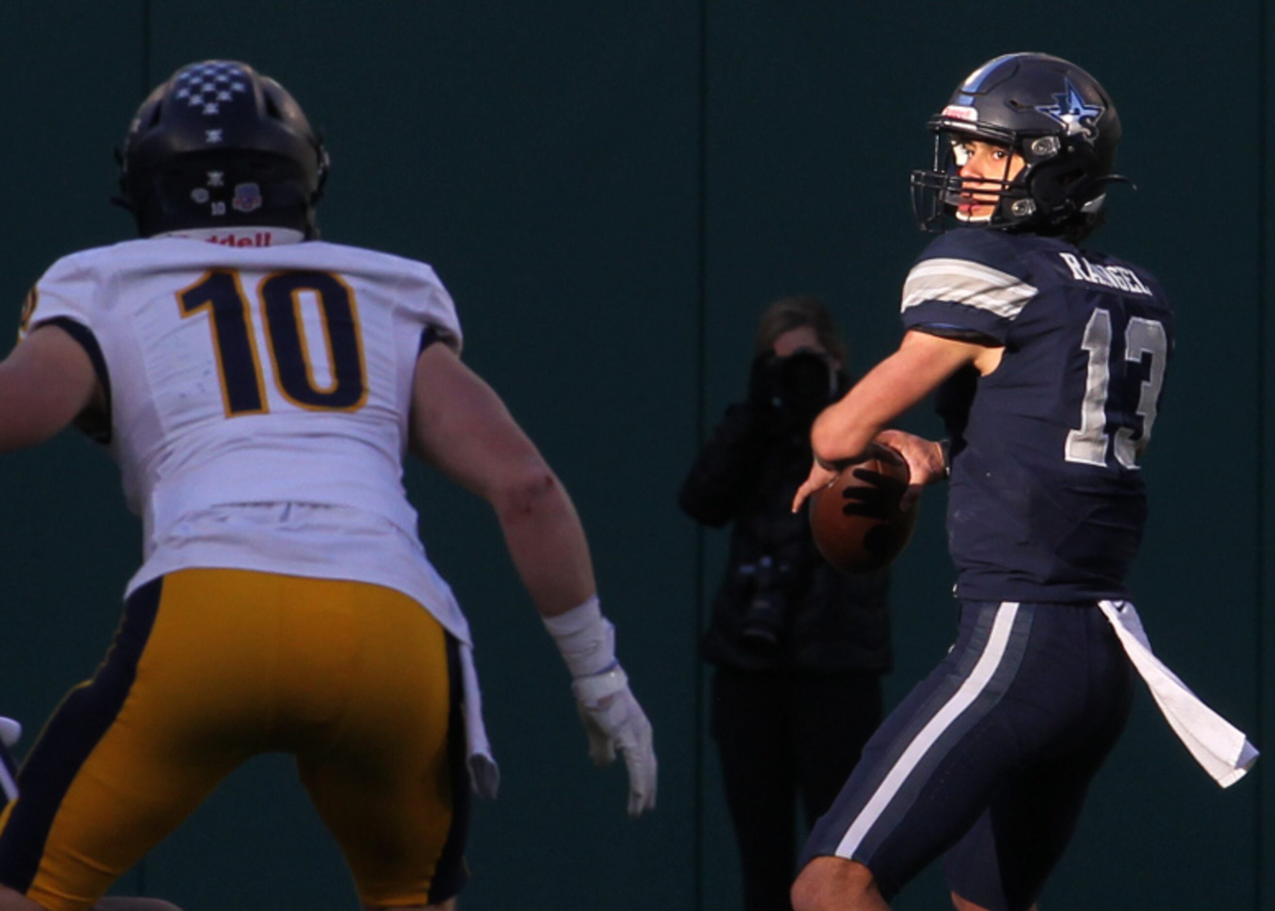 Frisco Lone Star quarterback Garret Rangel (13) looks to pass downfield as Highland Park...