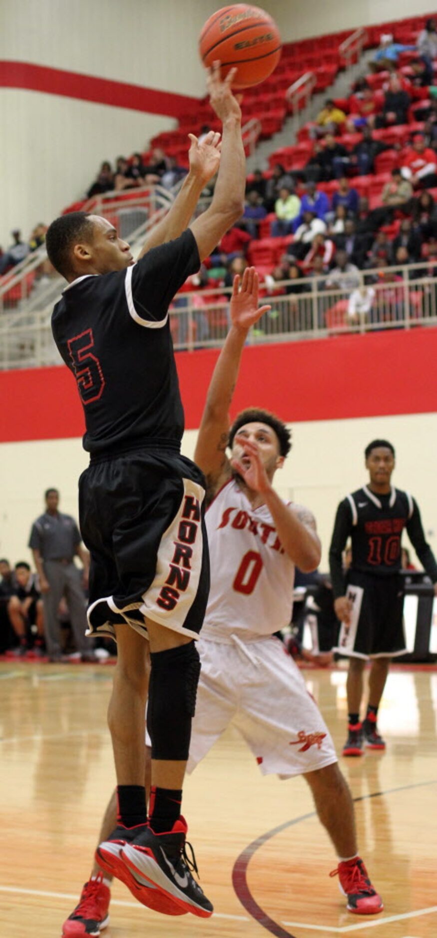 Cedar Hill guard Kealon Clayborne (5) scores on a jump shot during first half action over...