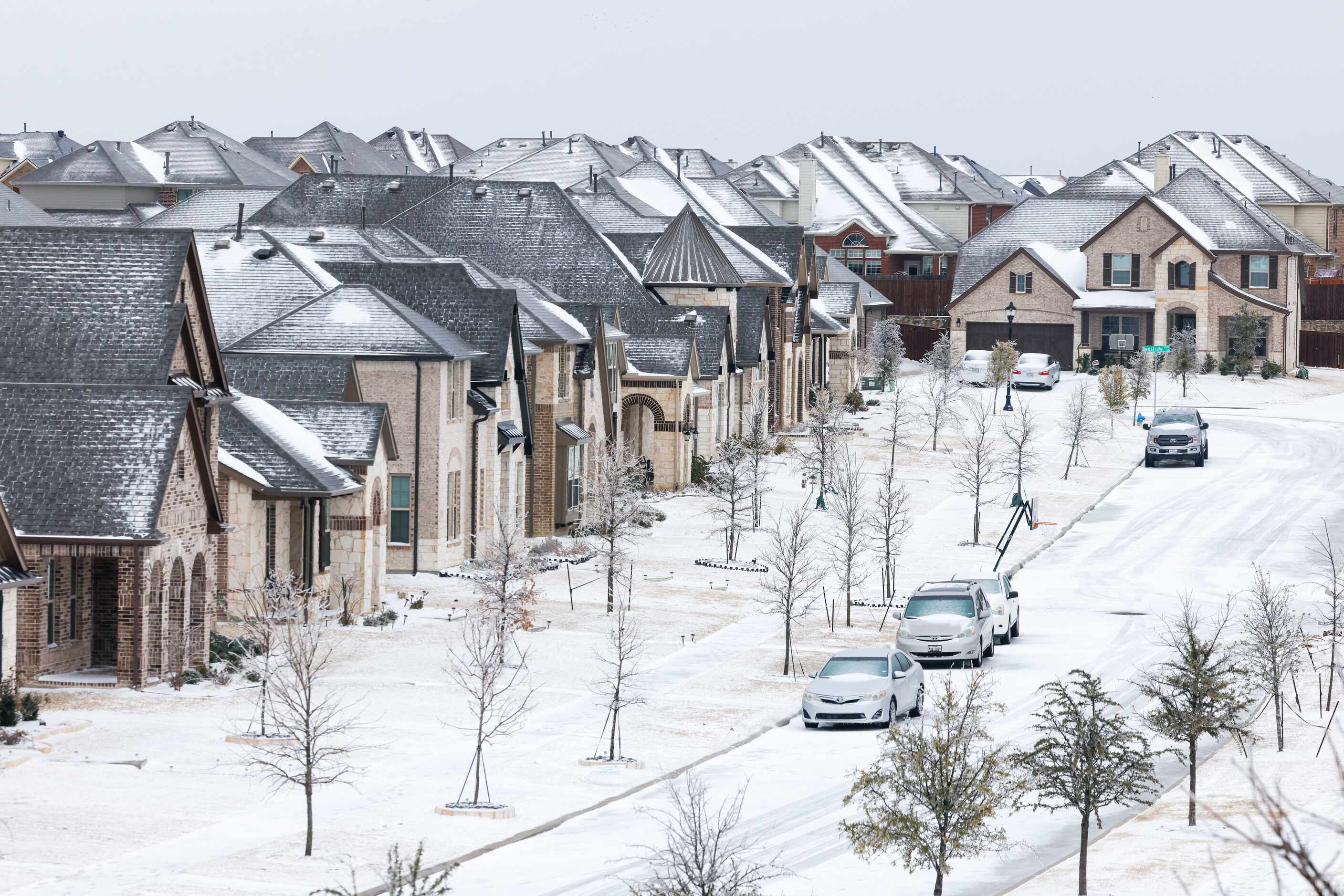 A neighborhood in Little Elm, Tx covered with snow is visible after a snowstorm on Thursday,...