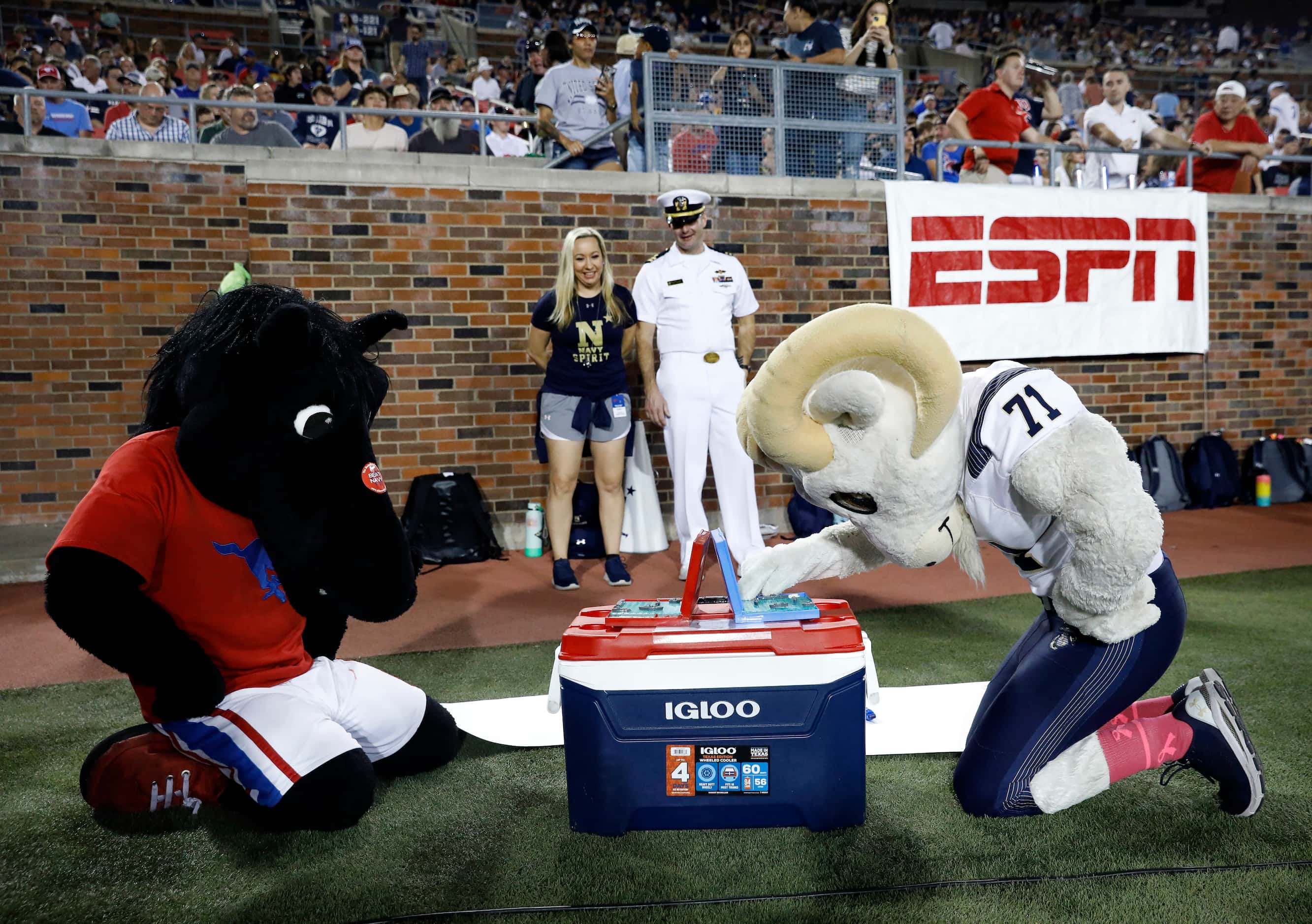 The Southern Methodist Mustangs mascot and the Navy Midshipmen mascot play a game of...