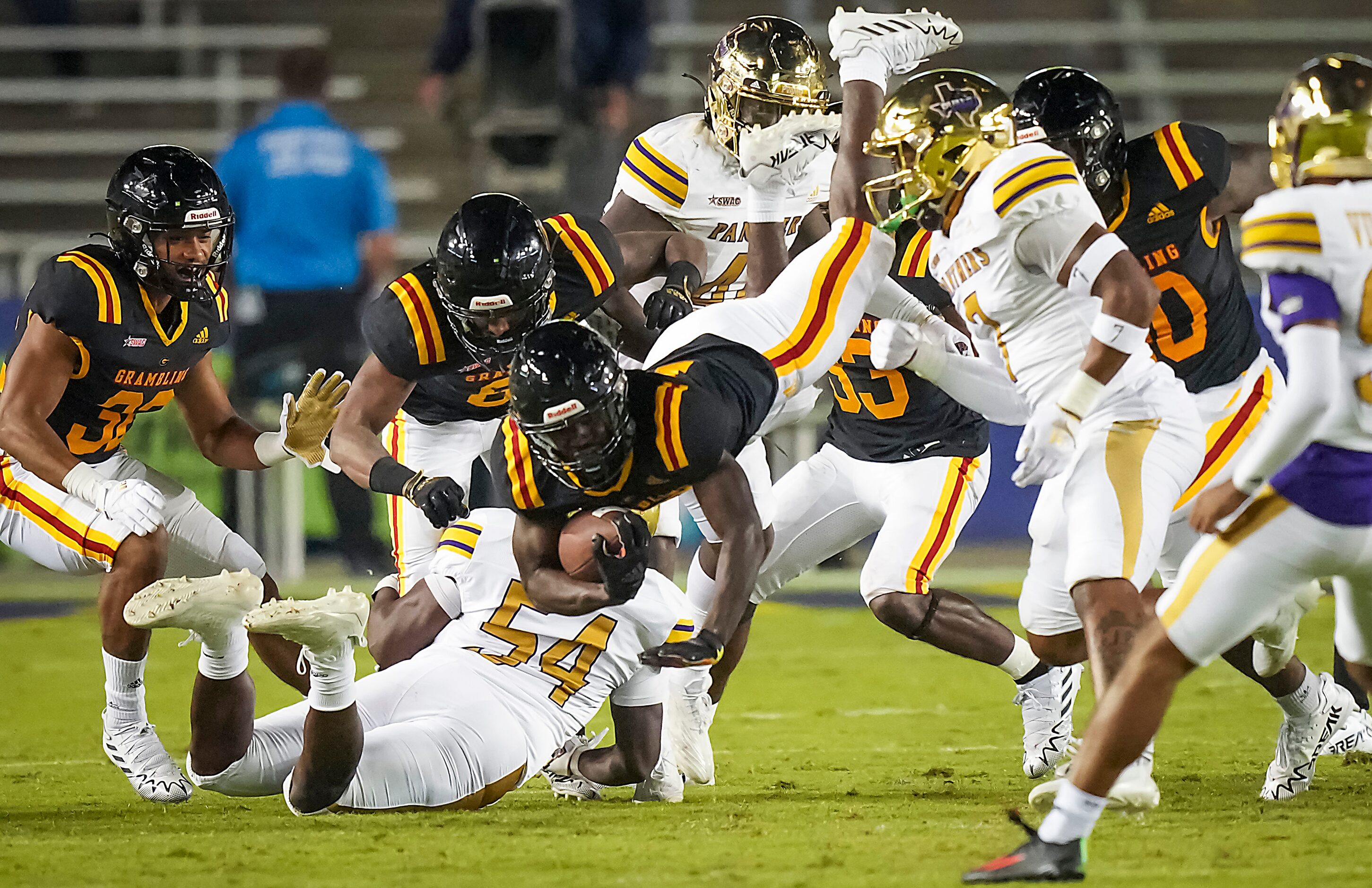 Grambling wide receiver Antonio Jones (19) is knocked off his feet by Prairie View...