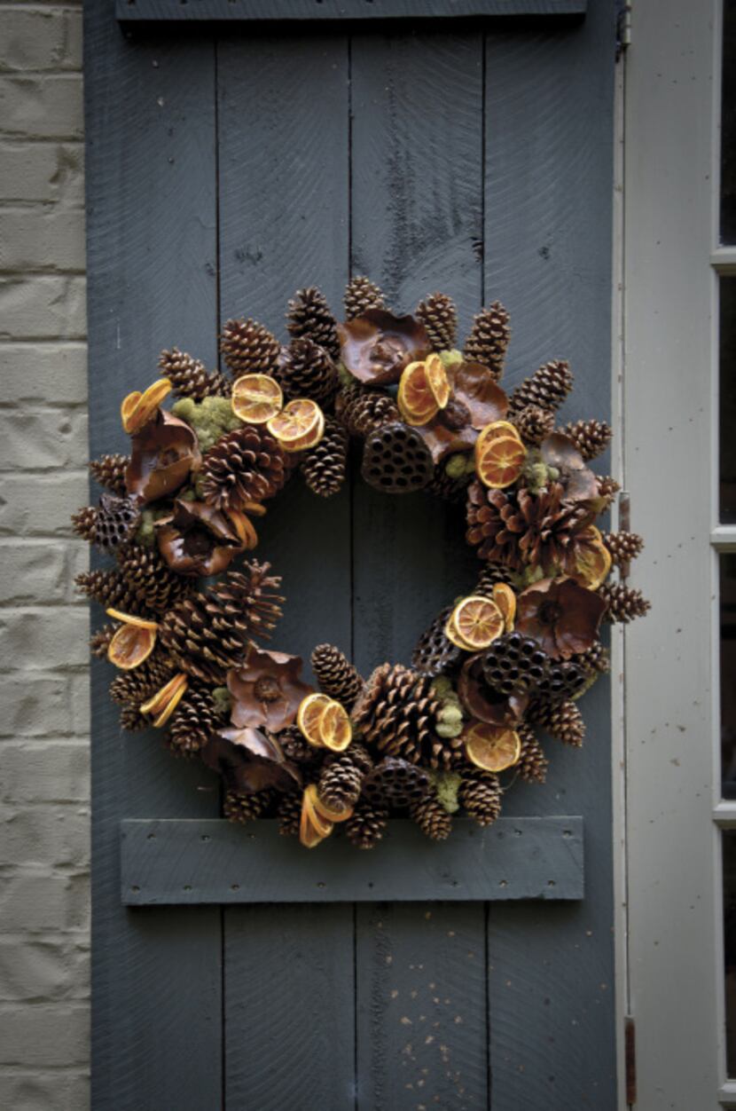 Slightly varnished pinecones in a mix of shapes and sizes placed in reindeer moss accented...