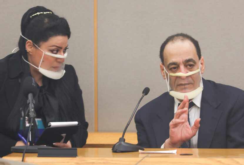 Legal interpreter Nancy Hakim (left) listens to Yaser Said, 65, on the stand during his...