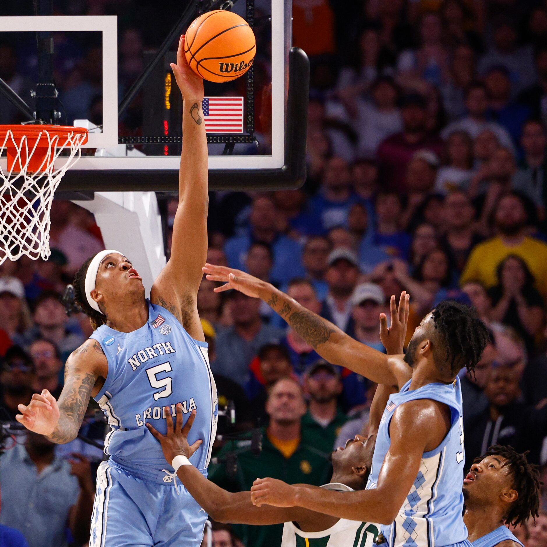 Baylor Bears guard Jordan Turner (5) blocks a shot attempt from Baylor Bears guard Adam...