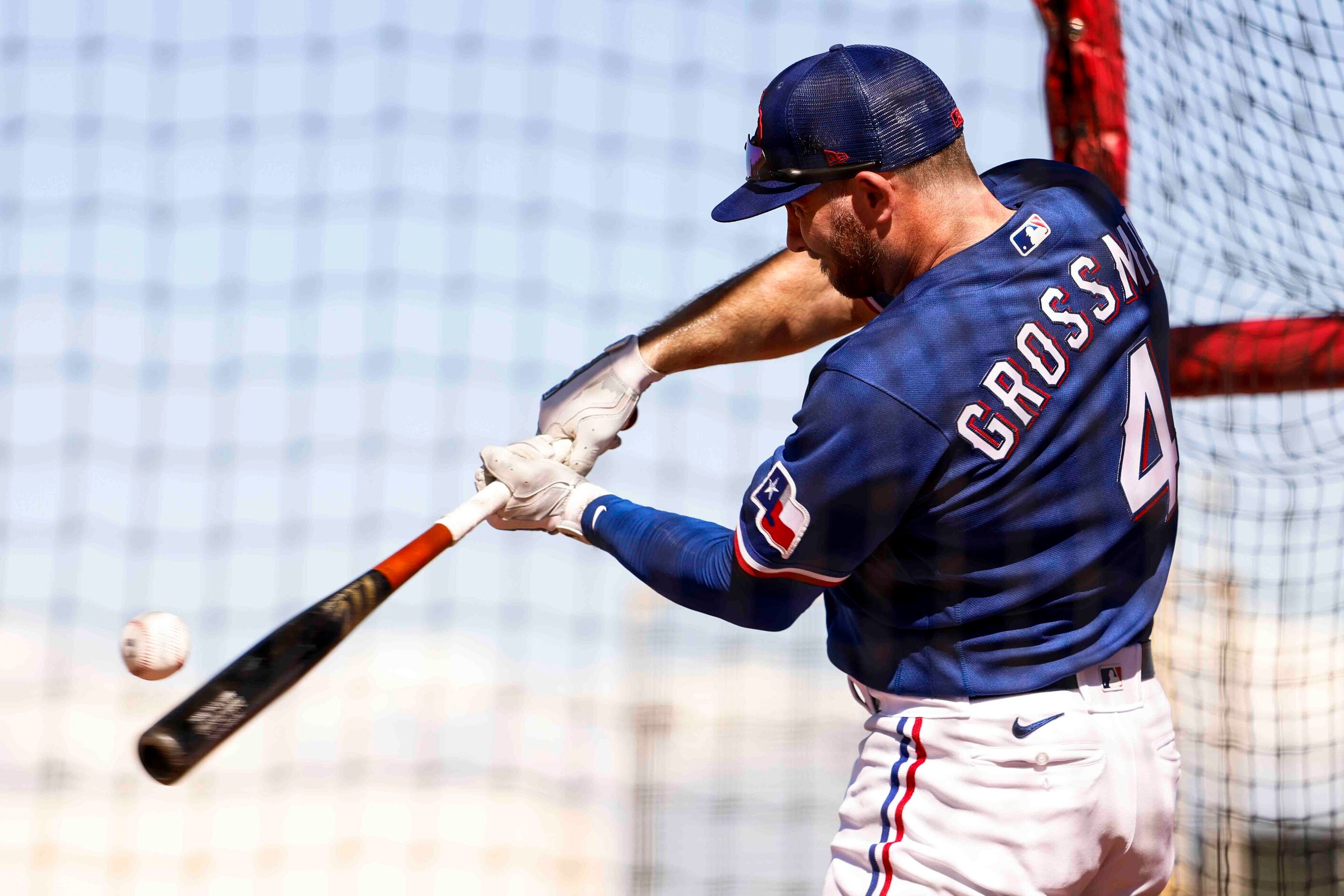 Texas Rangers outfielder Robbie Grossman takes part in a batting practice during a spring...