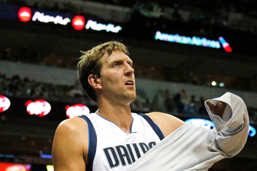 Dallas Mavericks forward Dirk Nowitzki (41) is pictured on the bench during the Houston...