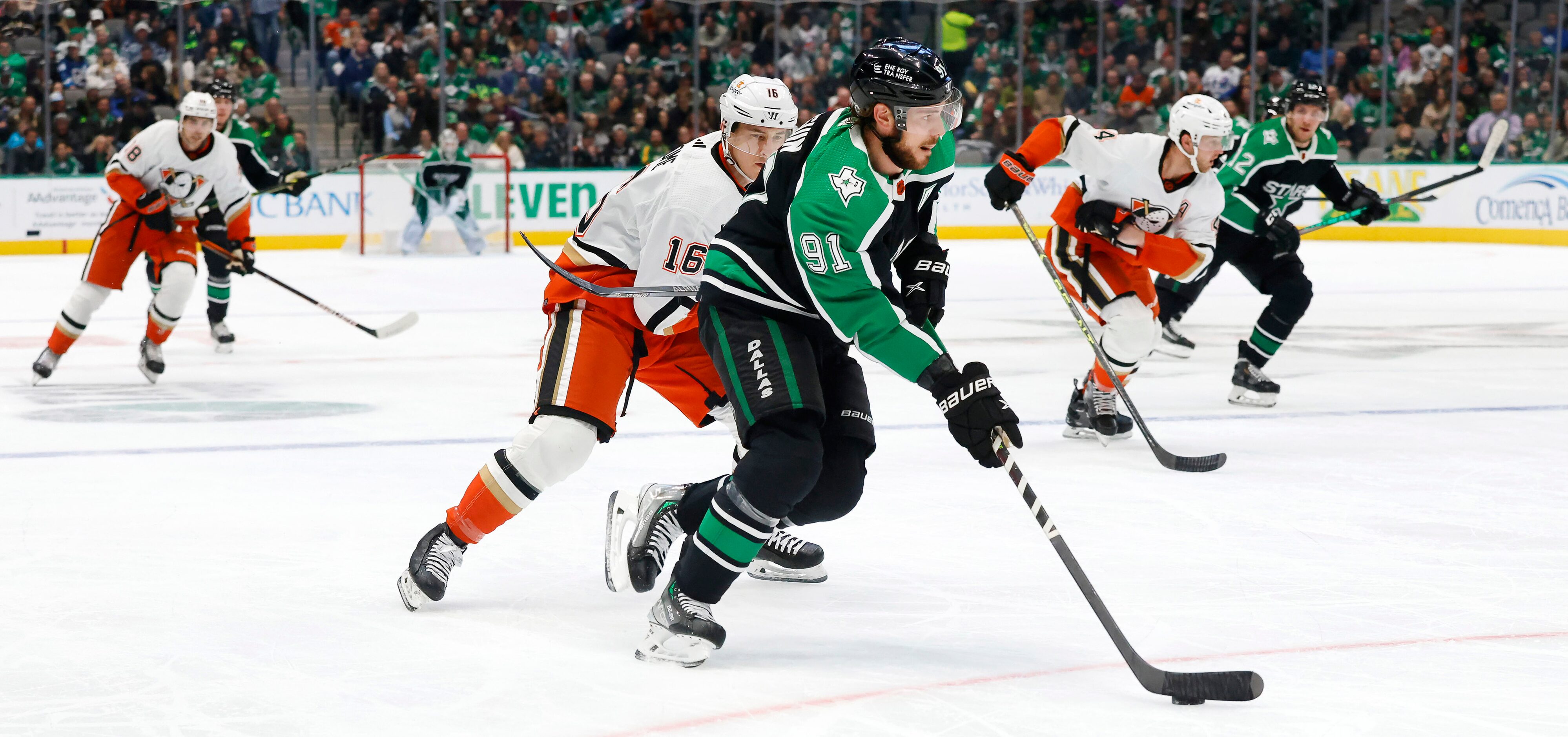 Dallas Stars center Tyler Seguin (91) brings the puck up ice as Anaheim Ducks center Ryan...