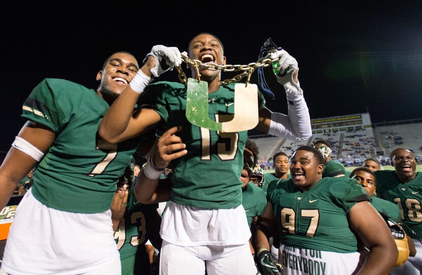 DeSoto senior linebacker Carl Davis III (15) wears the "turnover chain" as he celebrates...