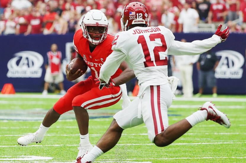 HOUSTON, TX - SEPTEMBER 03:  Greg Ward Jr. #1 of the Houston Cougars scrambles in front of...