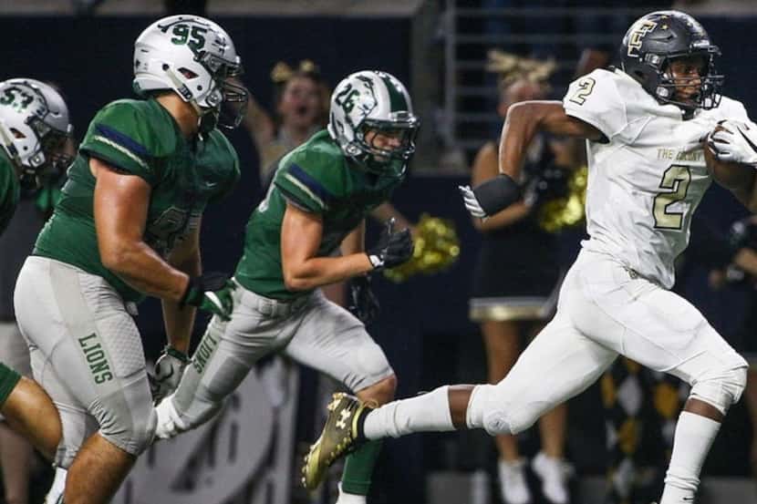 The Colony's Myles Price (2) runs for a touchdown past Frisco Reedy defensive tackle Brock...
