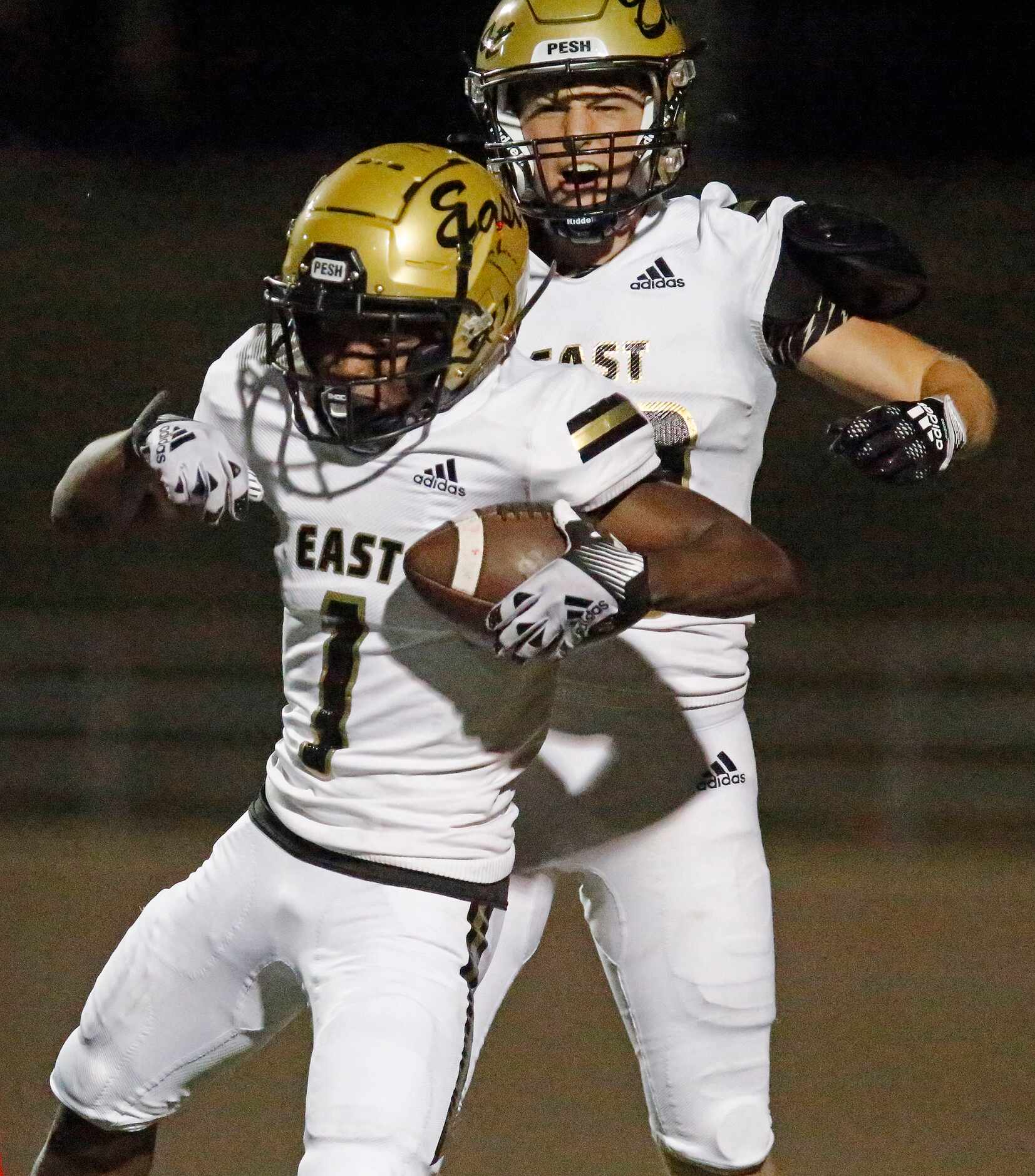 Plano East High School wide receiver Bryce Dixon (1) celebrates his touchdown with Plano...