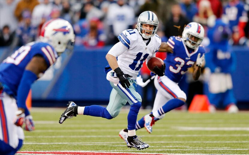 Dallas Cowboys wide receiver Cole Beasley (11) runs up the field after the catch in a game...