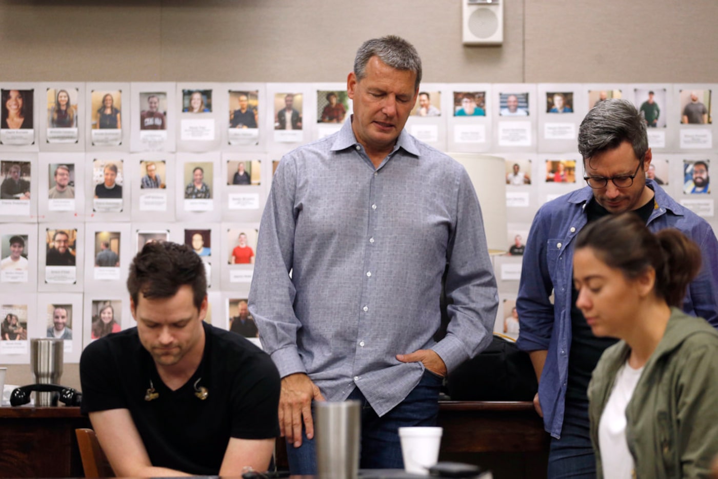 Senior pastor Todd Wagner prays with the Arts team before a Sunday service at Watermark...