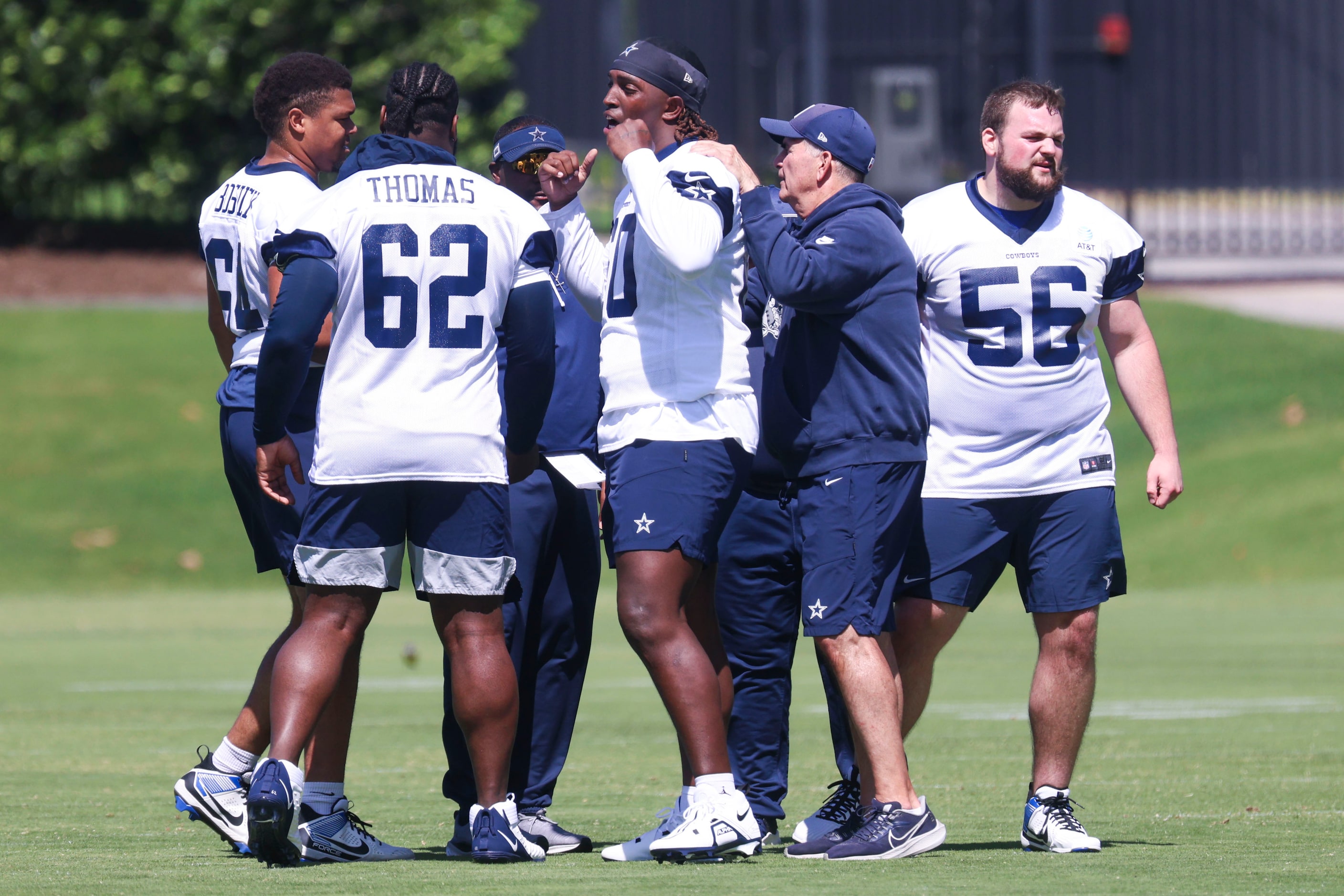 Dallas Cowboys offensive tackle Tyler Guyton (center) reacts while coming out of a huddle...