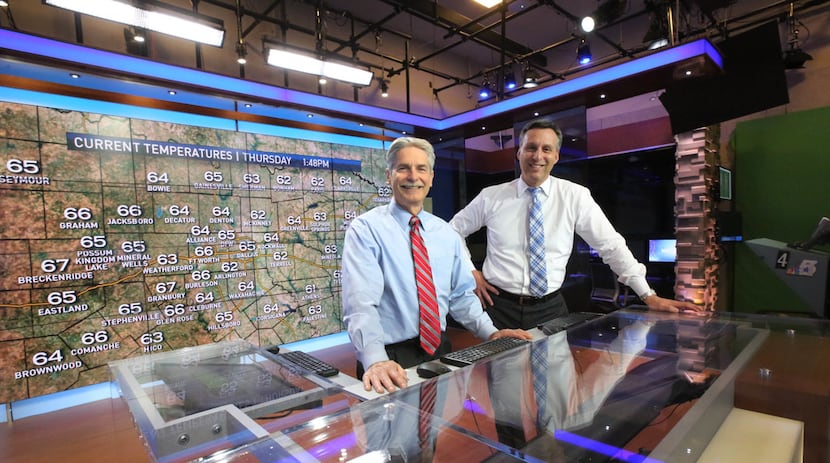 David Finfrock (left) and Rick Mitchell work together on forecasts, graphics and more to...