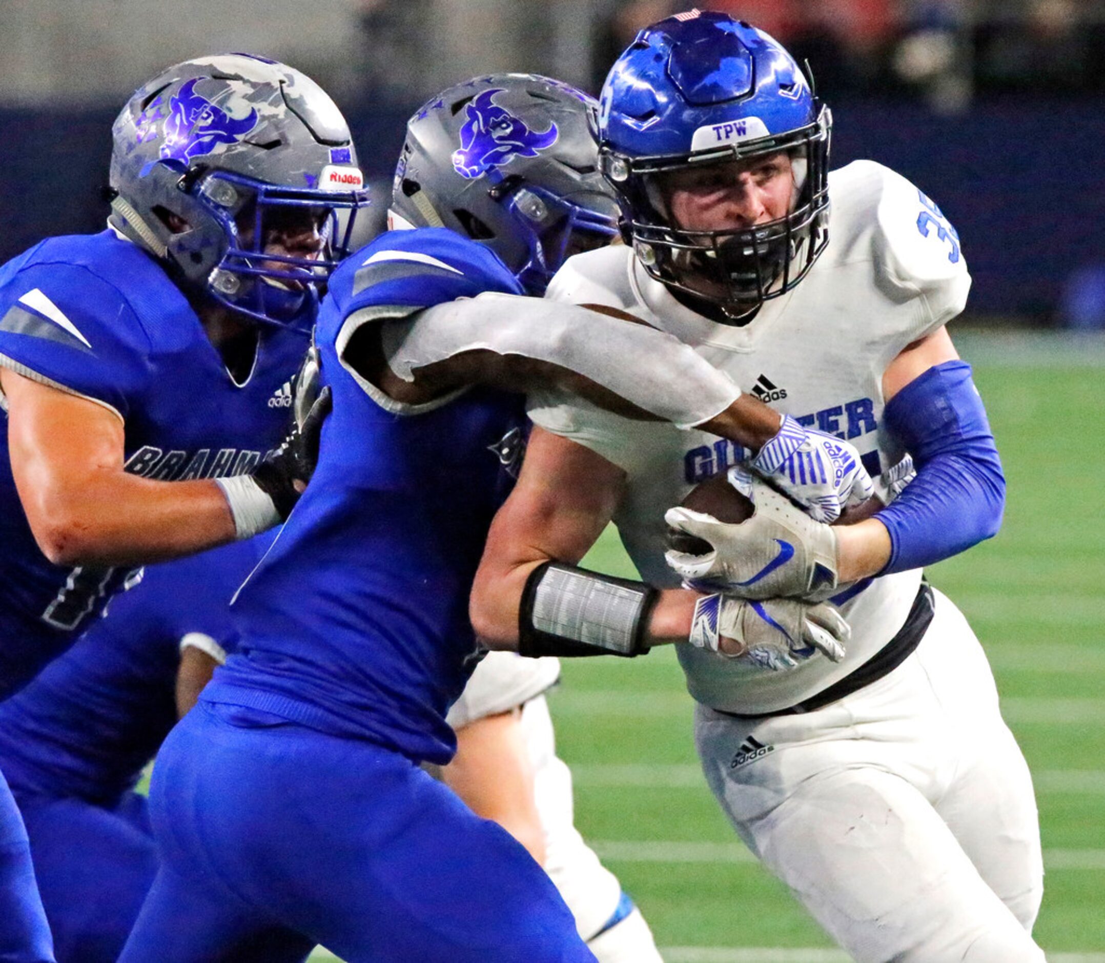 Gunter High School running back Peyton Lowe (35) is ridden out of bounds by Omaha Pewitt...