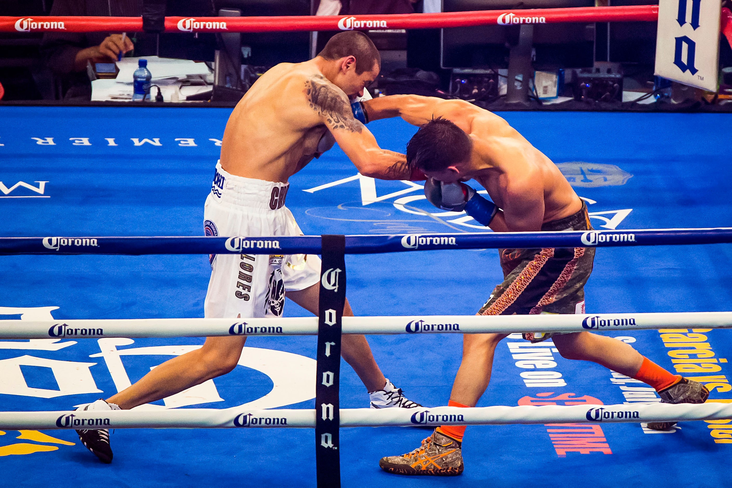 Daniel Roman (right), of Los Angeles, fights Moises Flores, of Guadalajara, Mexico, for the...