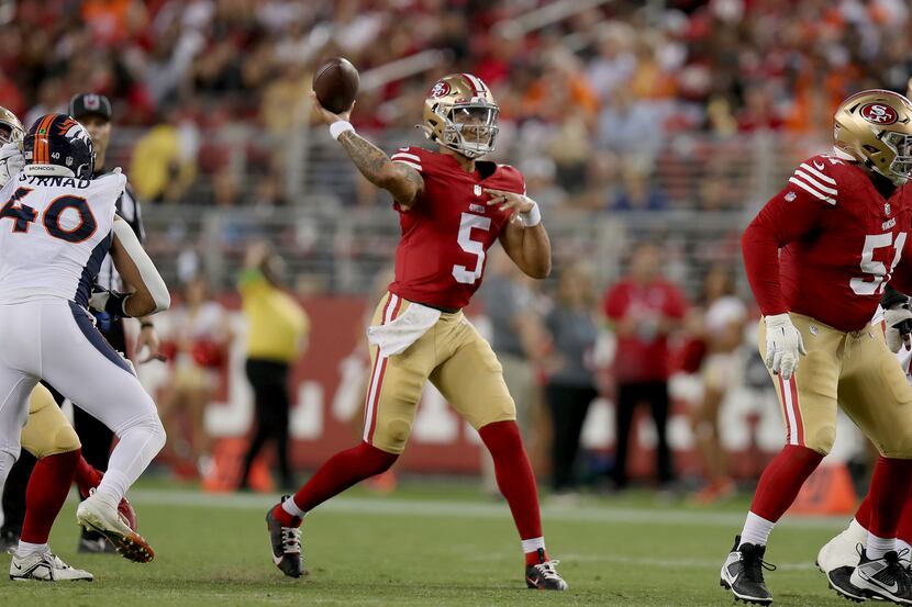 San Francisco 49ers quarterback Trey Lance (5) throws during an NFL football game against...