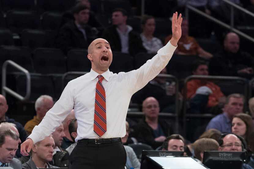 Texas head coach Shaka Smart reacts during the second half of a semifinal college basketball...