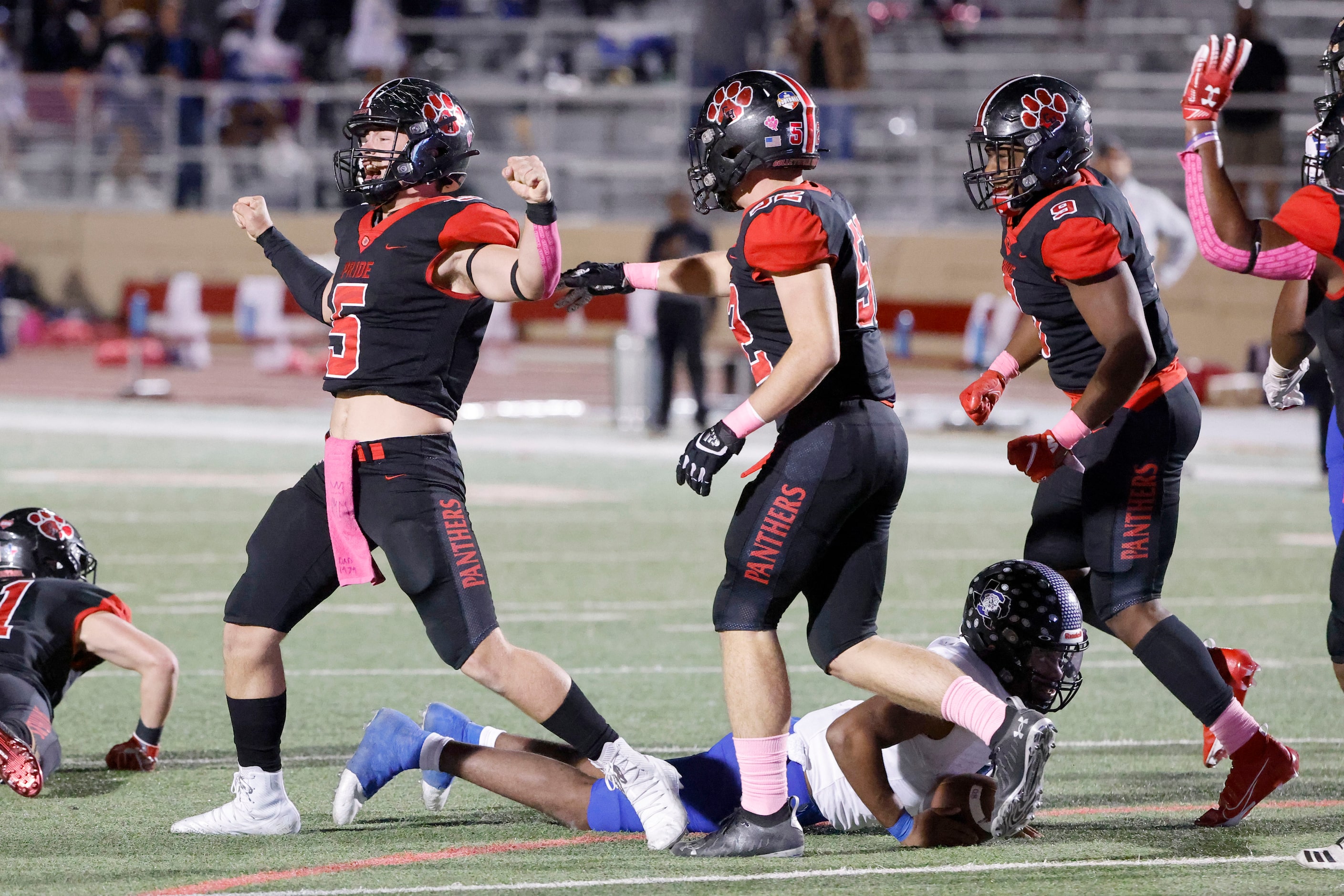 Colleyville Heritage players Kadin Richards (5), Steven Cole (52) and Garrett Finley (9)...