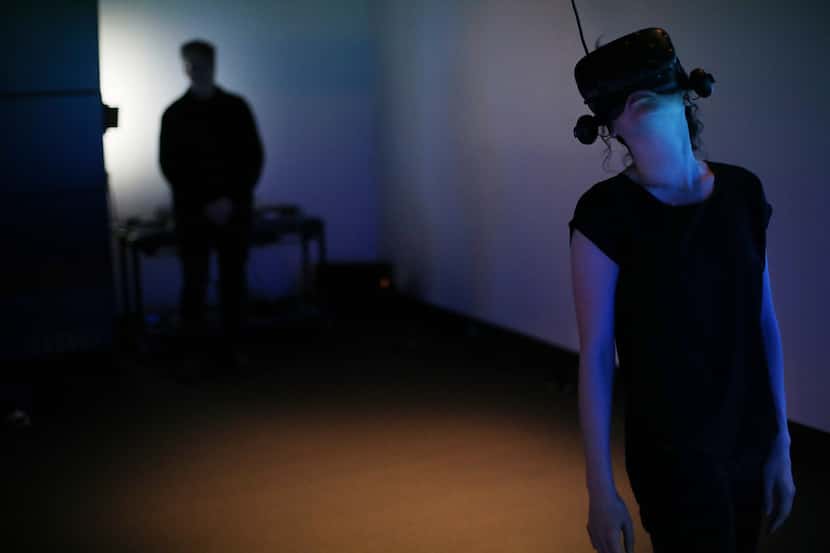 Student Tara Baker interacts with a virtual reality piece at the University of North Texas...
