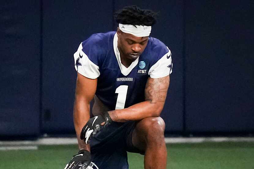 Dallas Cowboys cornerback Kelvin Joseph takes a knee between drills during the OTA team's...