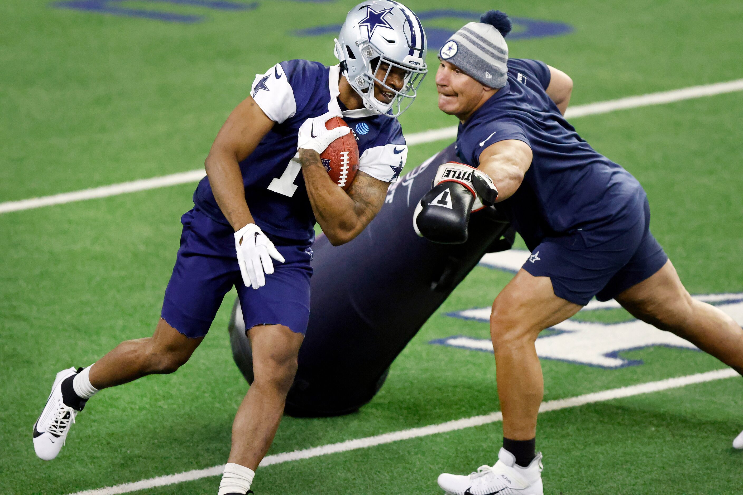 Dallas Cowboys cornerback Kelvin Joseph (1) runs through a tackling drill during a mini camp...