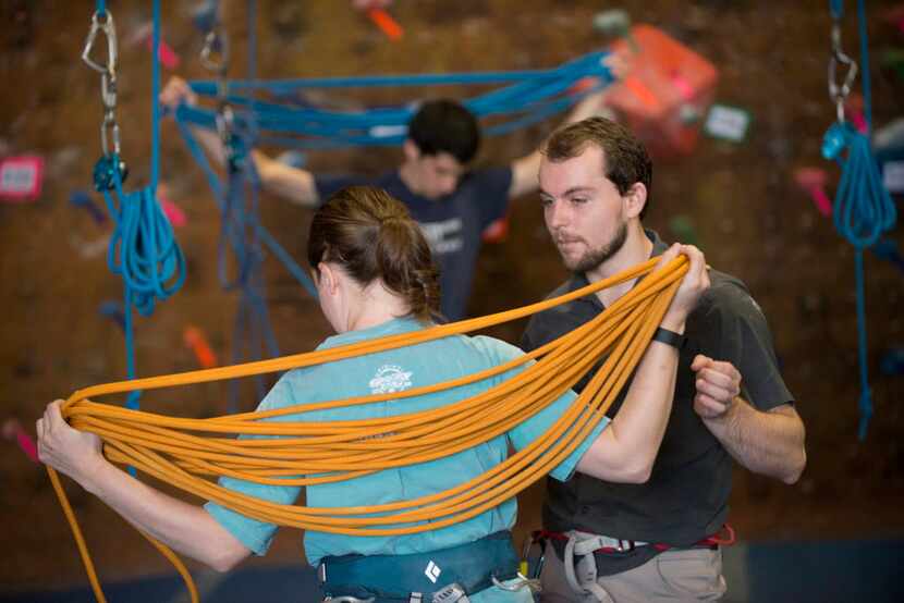 Instructor Ben Jensen watches as Stephanie Phillips rolls up her rope. There's a lot more to...