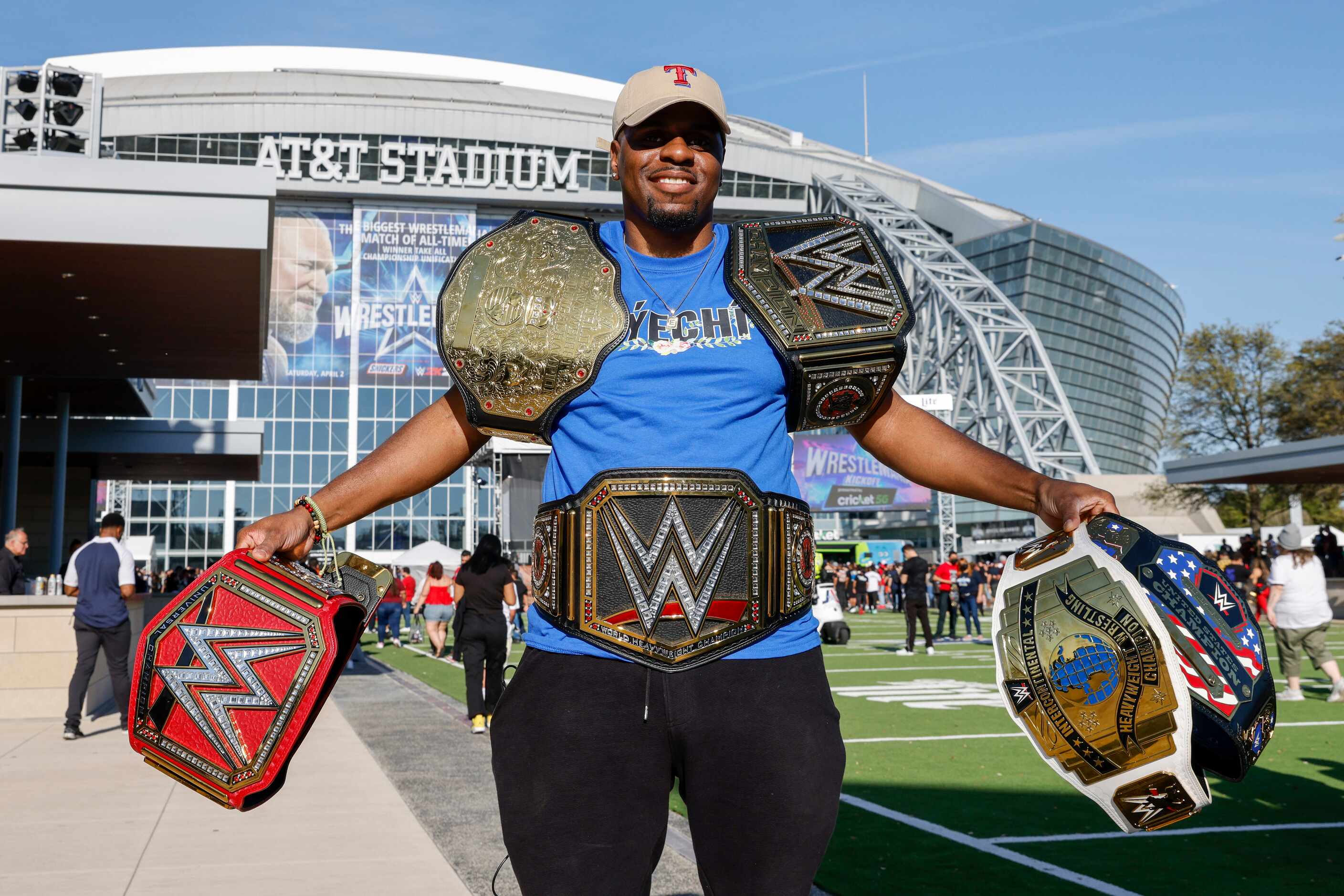 Jason Washington, 33, of Florida, displays his six WWE championship belts before...