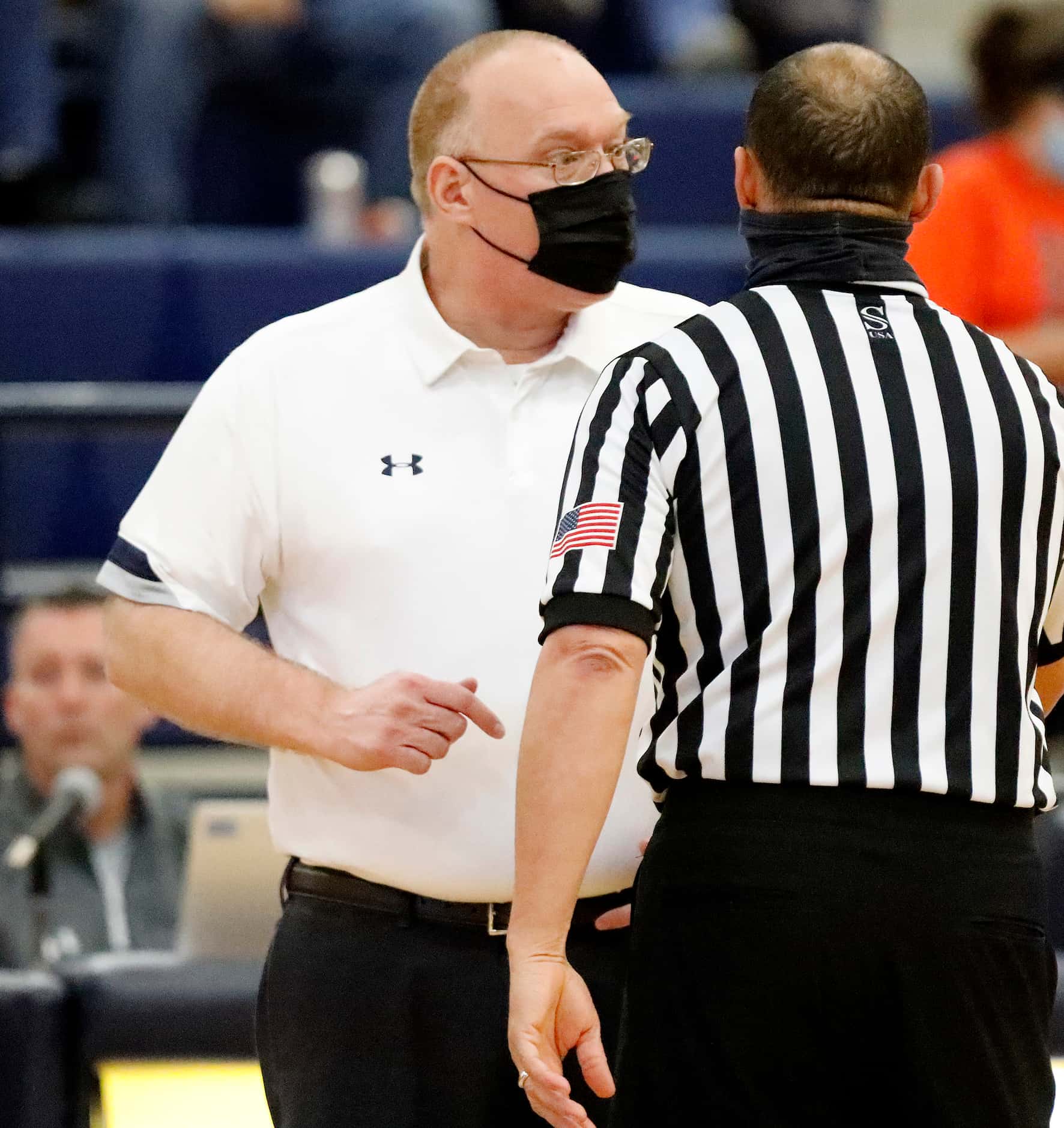 McKinney North High School head coach Darryll Craft argues a call during the first half as...