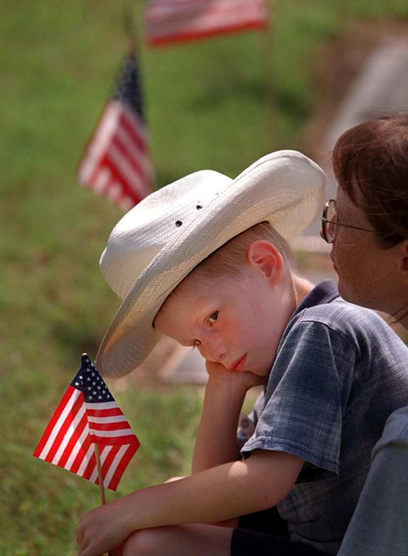  Leslie Thomas holds her son Lucas Thomas, 5, of Duncanville, Monday, at the 54th annual...