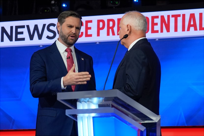 Republican vice presidential nominee Sen. JD Vance, R-Ohio, talks with Democratic vice...