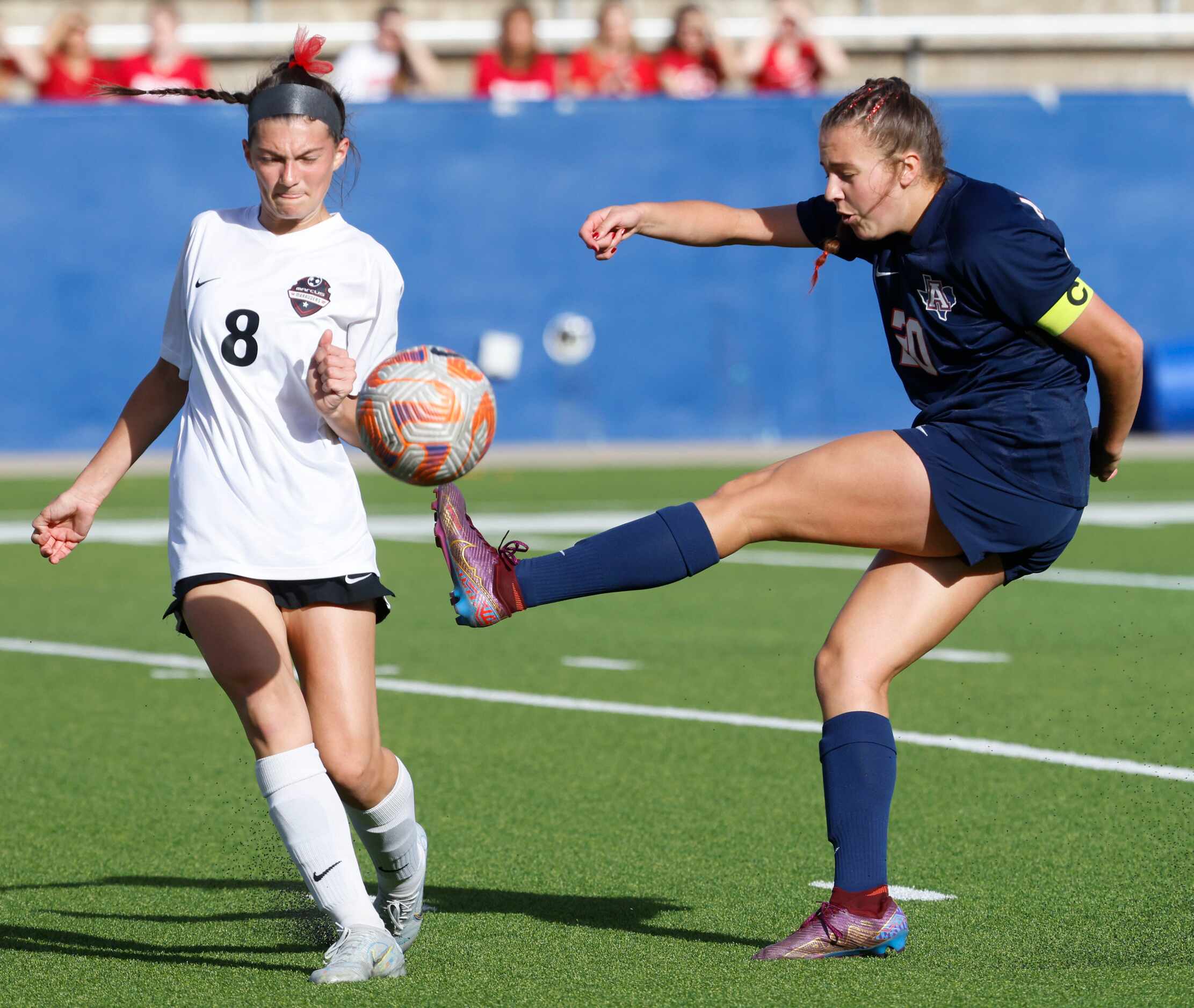 Allen’s Jillian Anderson shoots past Marcus’ Emma Fioretti (left) during the first half of a...