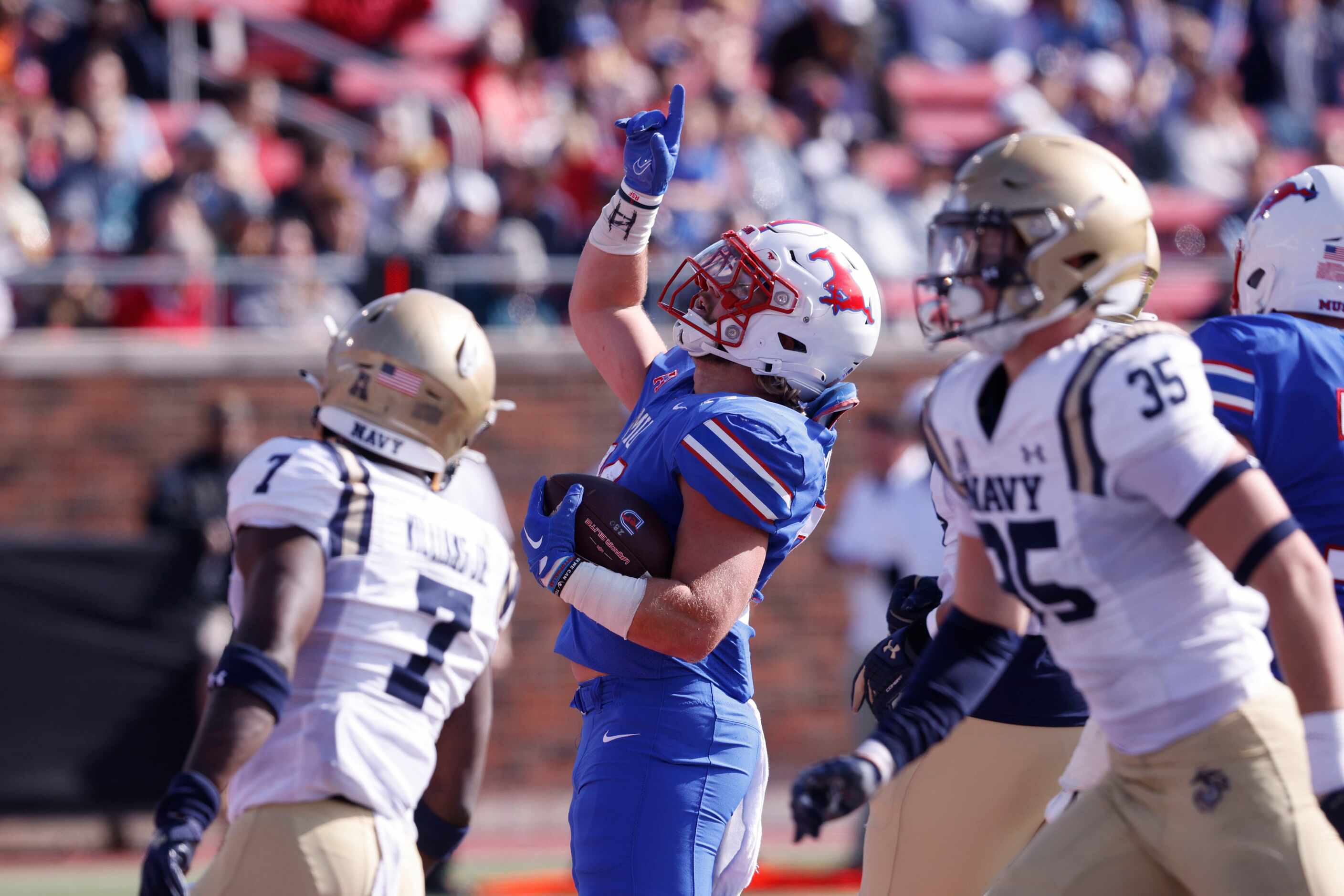 SMU running back Tyler Lavine (31) celebrates after he scored a touchdown against the Navy...