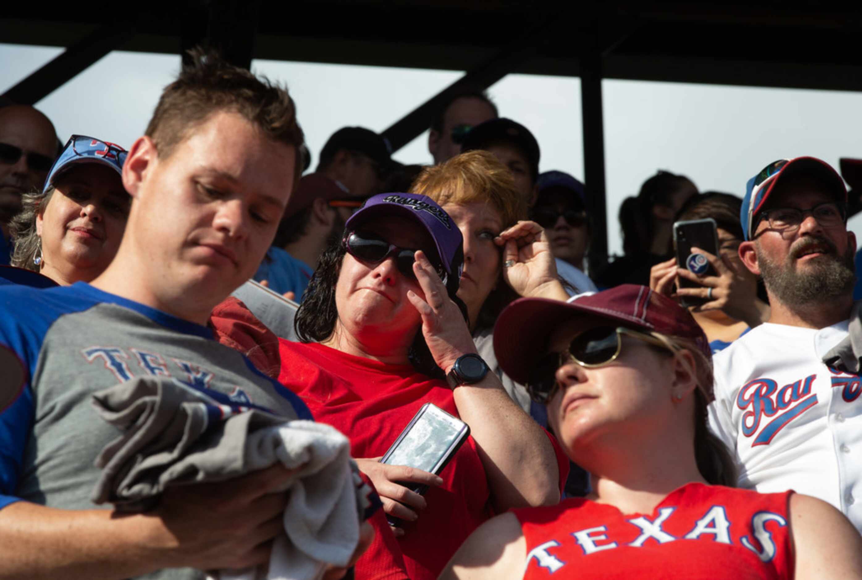 Fans wipe away tears at the conclusion of the Texas Rangers' final game ever played at Globe...