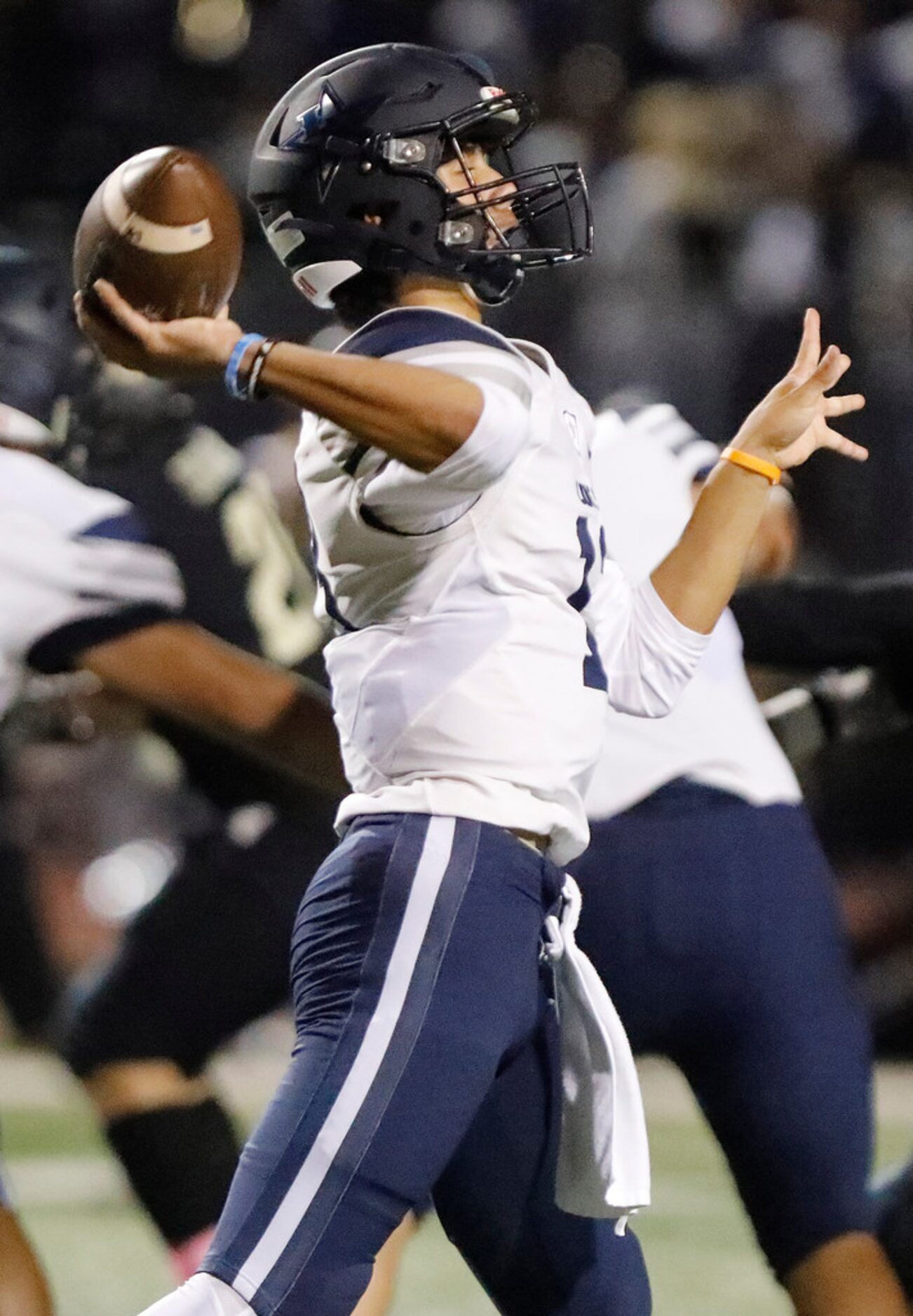 Lone Star High School quarterback Garret Rangel (13) throws a pass during the first half as...