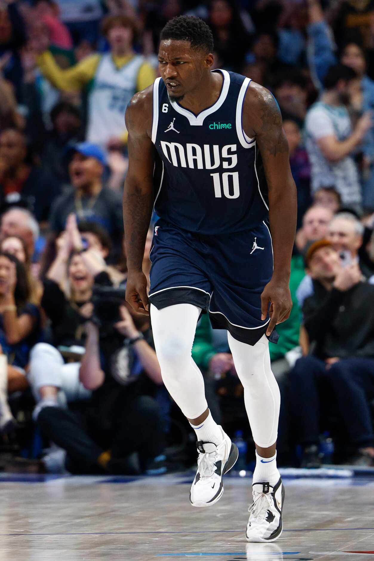 Dallas Mavericks forward Dorian Finney-Smith (10) celebrates a three-point shot during the...