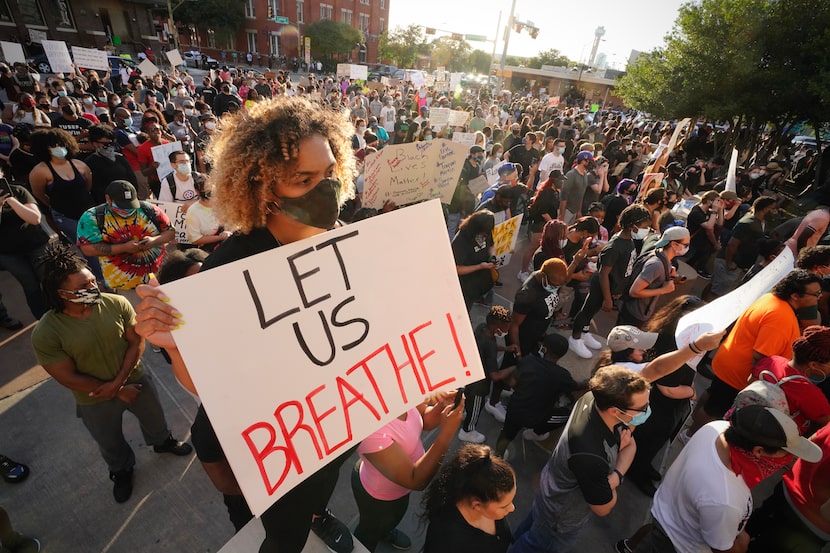 Tiona Bowman protests outside the Dallas Police Headquarters on Friday, May 29, 2020, in...