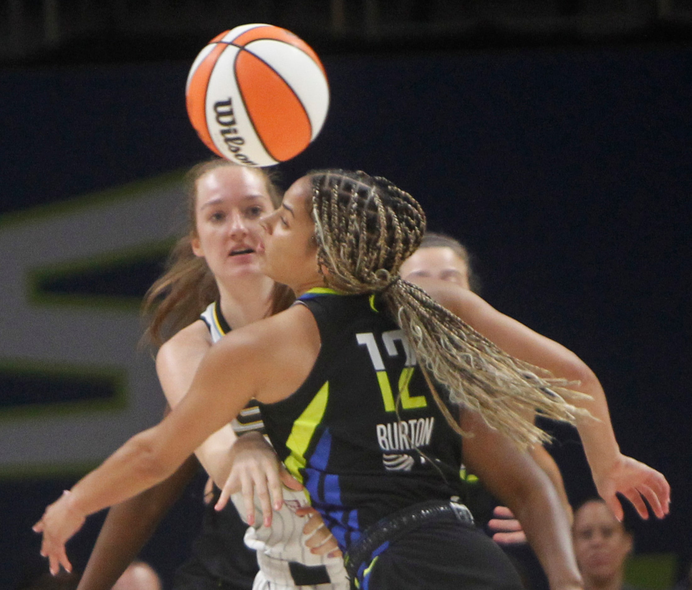 Dallas Wings guard Veronica Burton (12) swats at a pass made by Chicago Sky forward Morgan...