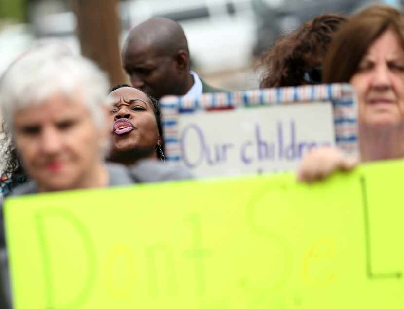 Monica Lindsey, education organizer with the Texas Organizing Project, shouts during a...