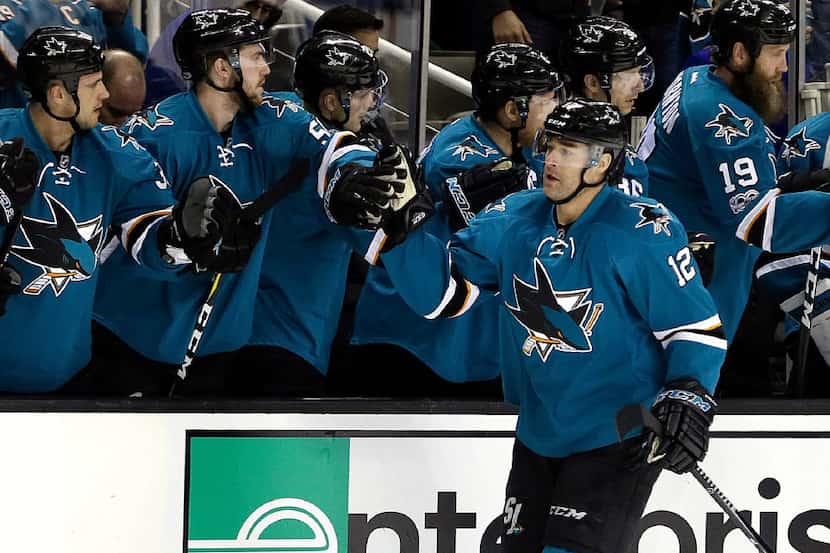 San Jose Sharks' Patrick Marleau (12) is congratulated after scoring a goal against the...