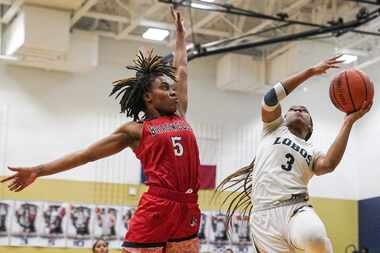 Denton Braswell High School’s Danae Crosby (5) defends Little Elm High School’s  Amarachi...