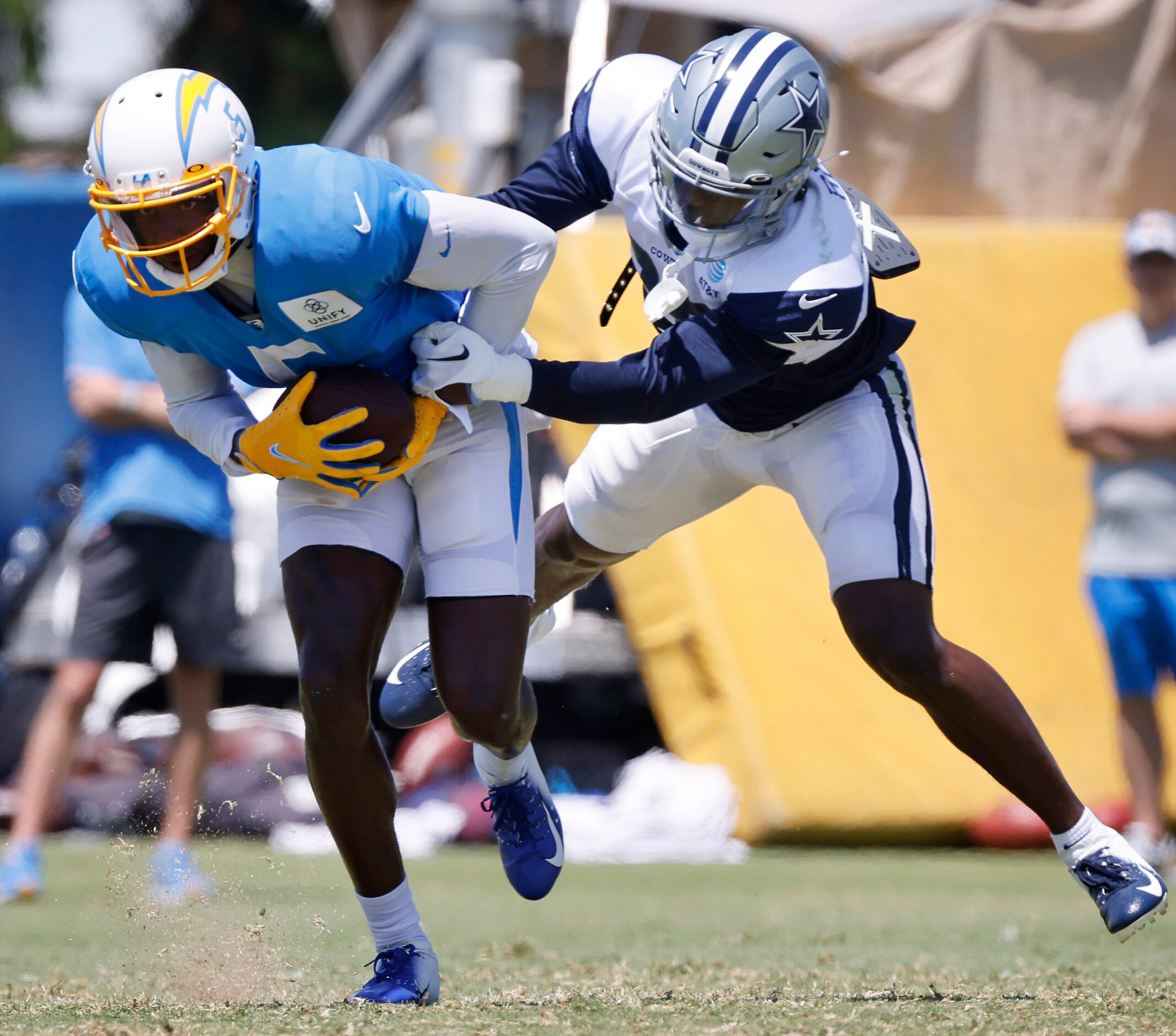 Dallas Cowboys cornerback DaRon Bland (30) attempts to bring down Los Angeles Chargers wide...